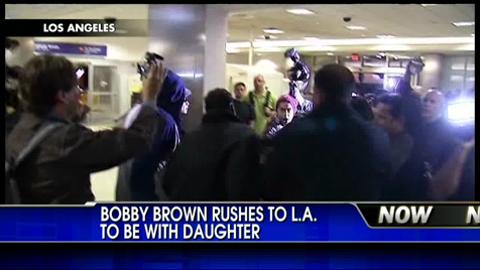 Bobby Brown Rushes to Los Angeles in Wake of Whitney Houston’s Death, Swarmed By Masses of Paparazzi
