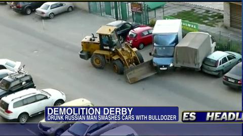 Must-See Video: Drunk Man in Russia Punched Out After Bulldozing Parked Cars