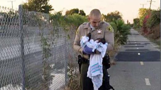 Police search for parents of newborn buried alive