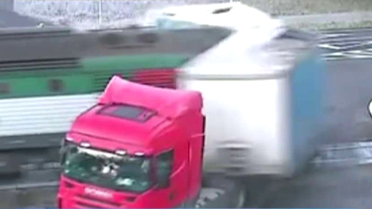 Truck breaks into two after collision with speeding train