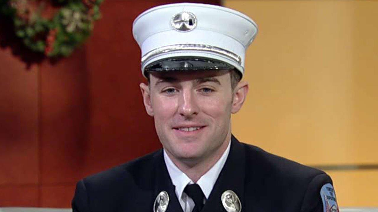 Firefighter crawls through flames to save woman on Christmas