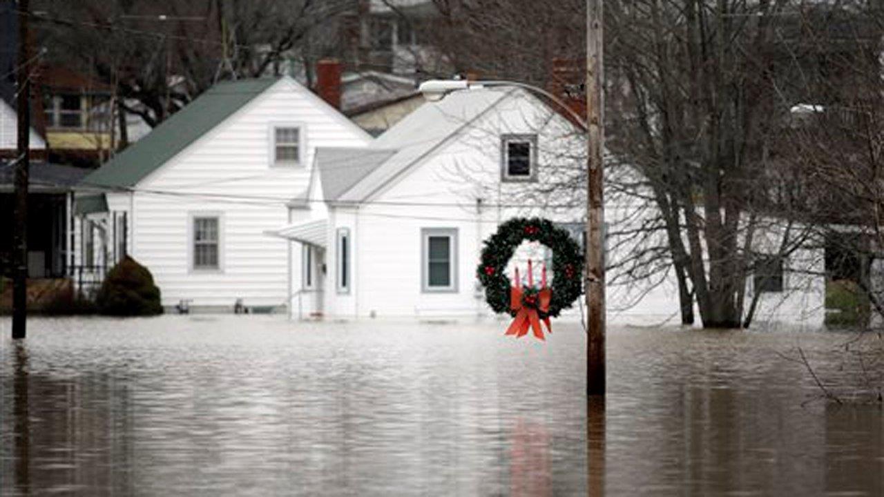 Flooding has claimed at least 18 lives in Illinois, Missouri