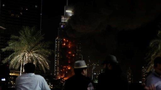 Dubai rings in the New Year as luxury hotel burns