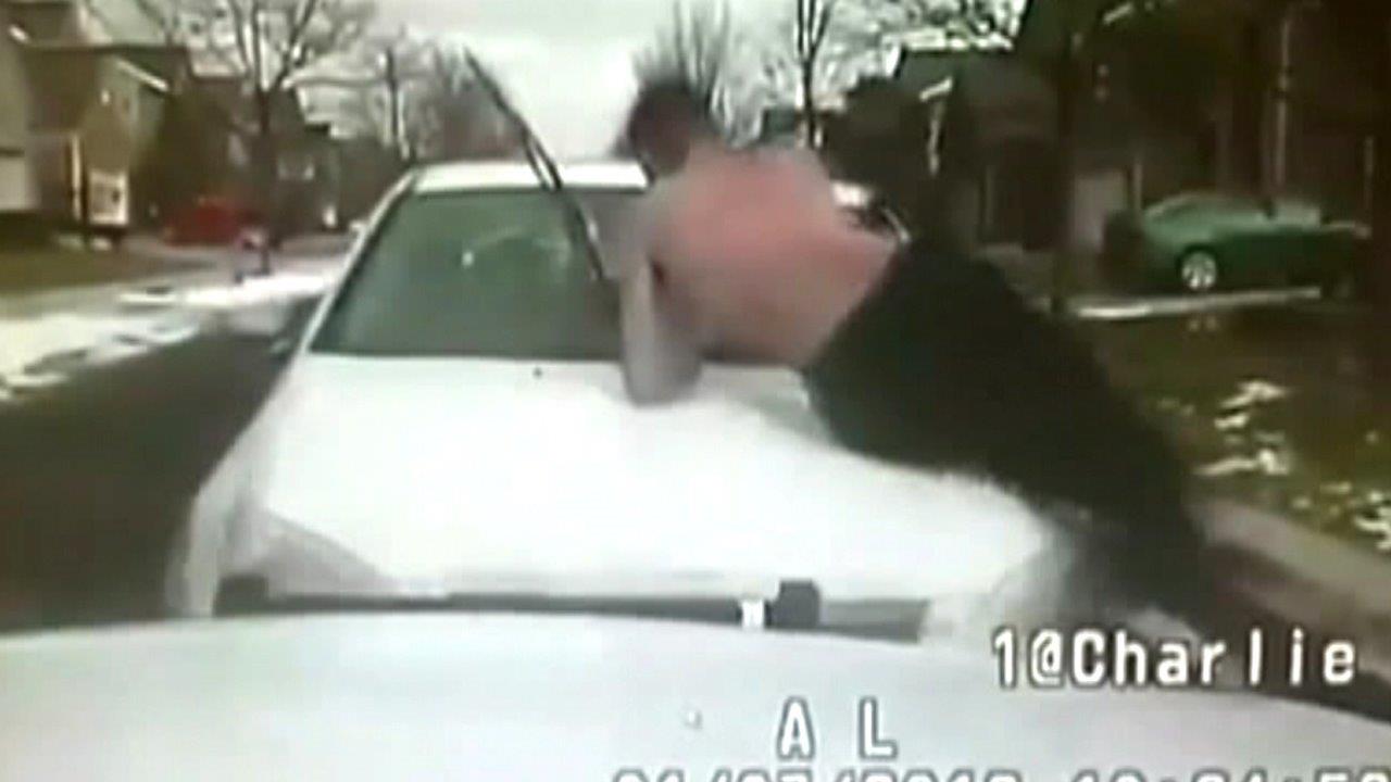 Driver crashes into cop car with shirtless brother on hood