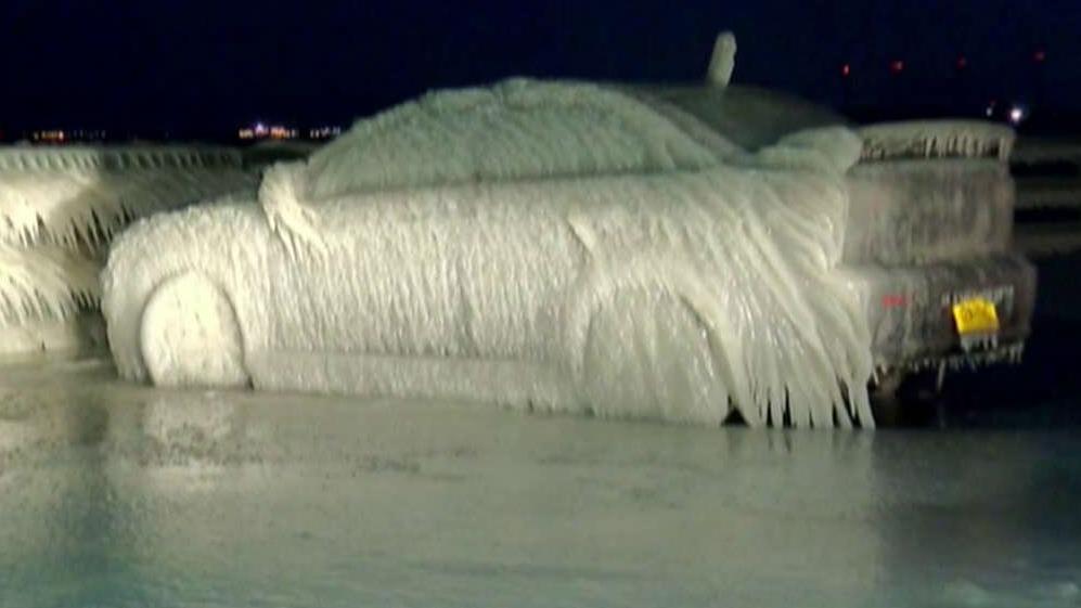 New York arctic blast freezes car to parking spot
