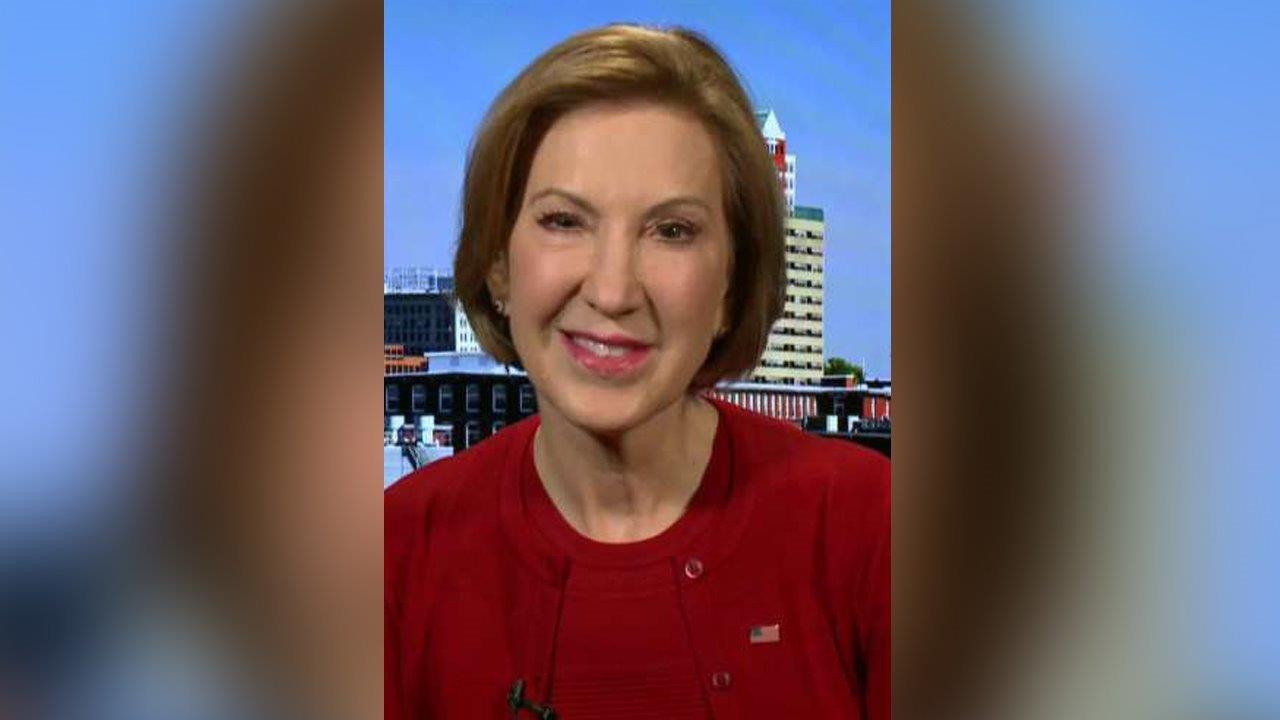 Fiorina attacks Clinton in undercard debate 