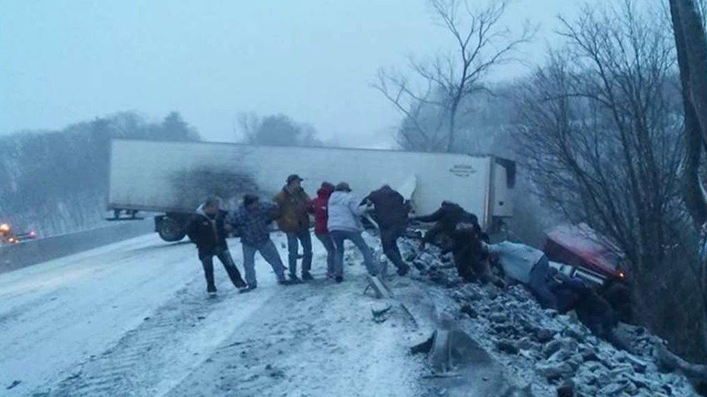 Strangers form human chain to save truck driver