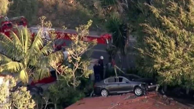 Car crash lands on roof in California 