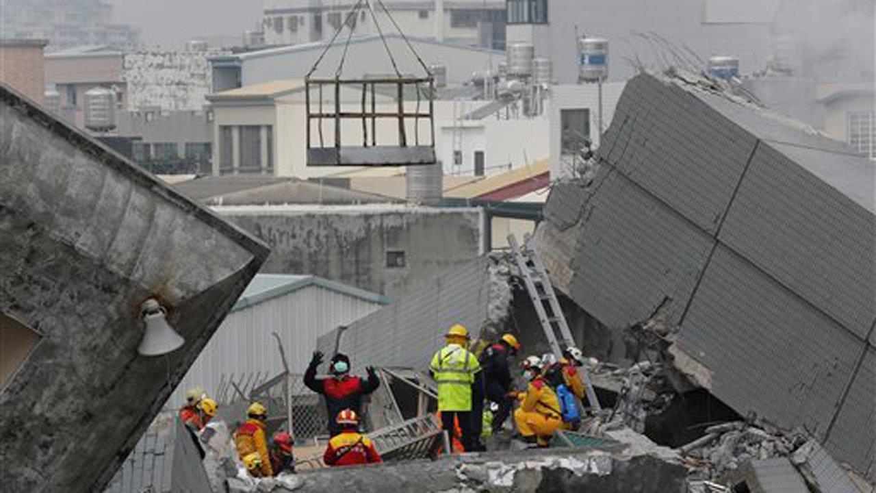 At least 14 dead, 100 missing after earthquake hits Taiwan 