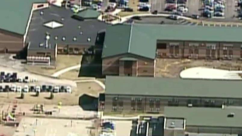 Teen charged after opening gunfire in Ohio school cafeteria