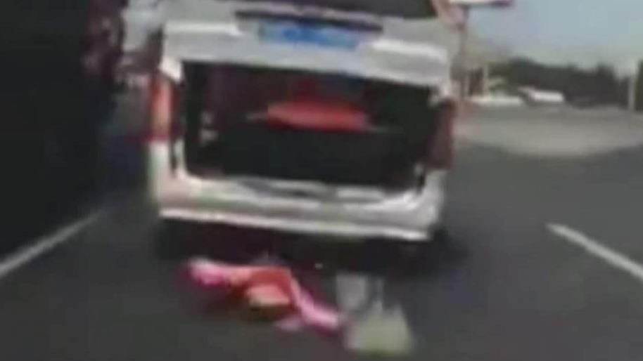 Toddler falls out of moving van onto highway in China