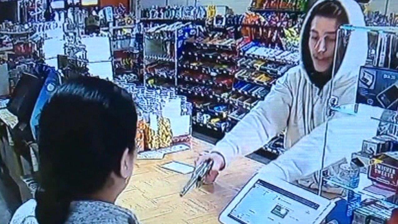 Clerk face-to-face with armed robber doesn't back down