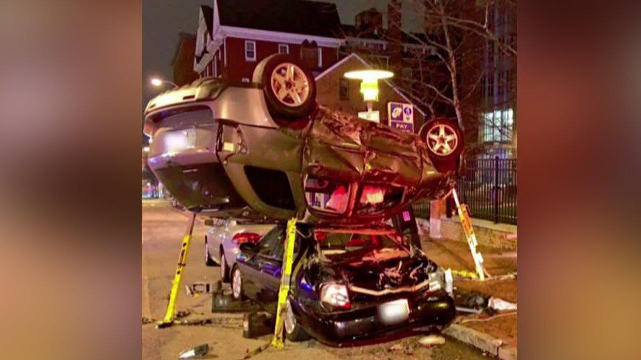 Car accident ends with one vehicle on the roof of another
