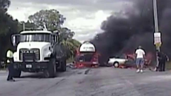 Dashcam: Officers rescue woman from burning car