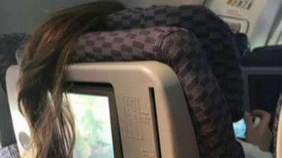 Plane passenger's 'awful' ponytail placement goes viral