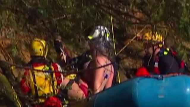 Trapped teens rescued off cliff above rushing waters