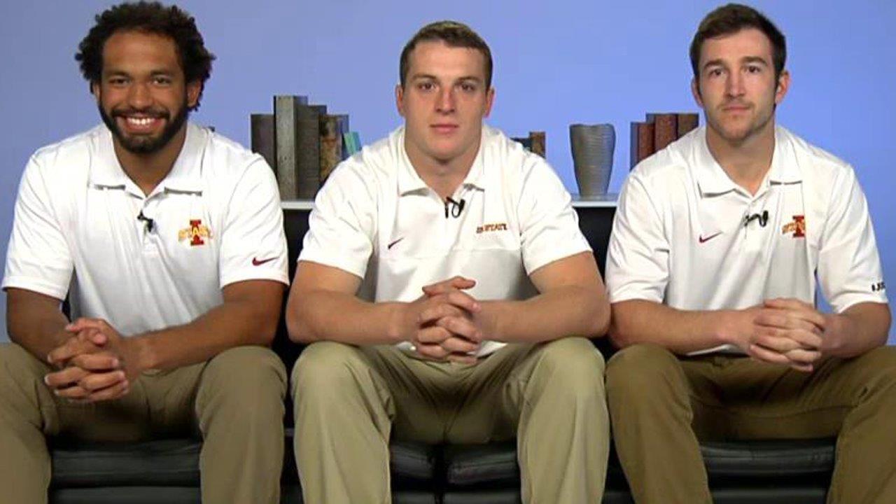 College football players save woman from sinking car