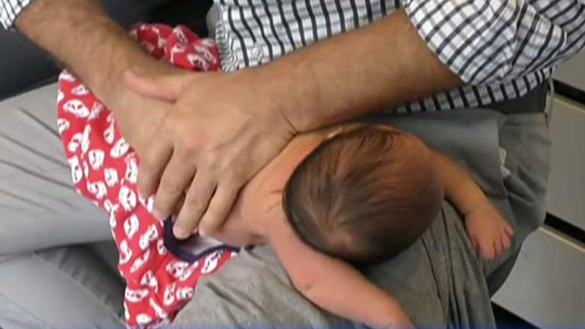 Doctors condemn chiropractor cracking newborn baby's back