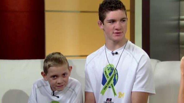 Teen carries brother with cerebral palsy on 111 mile trek