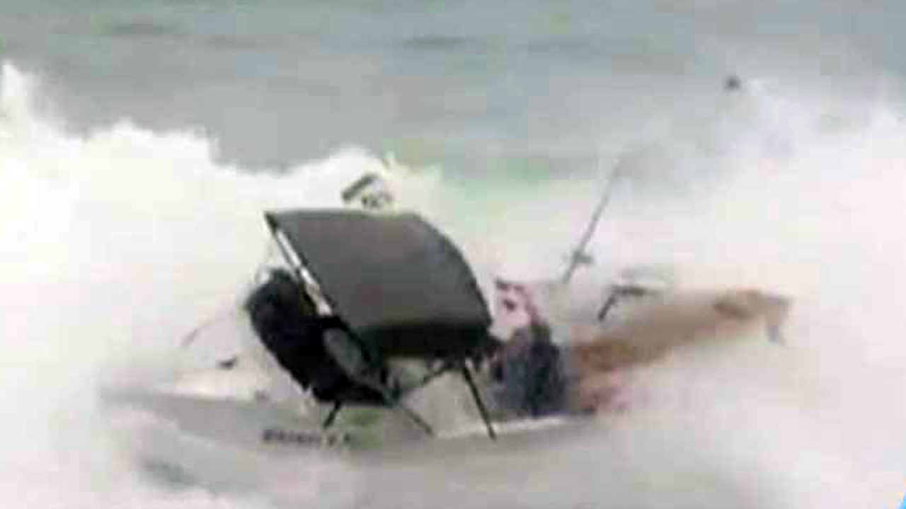 Wipeout: Surfers' boat tossed by gnarly waves