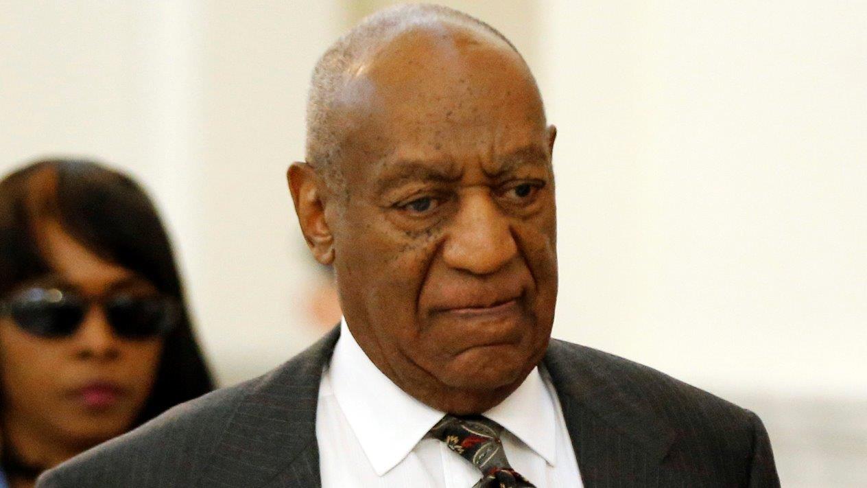 Cosby nods as judge orders trial for sexual assault