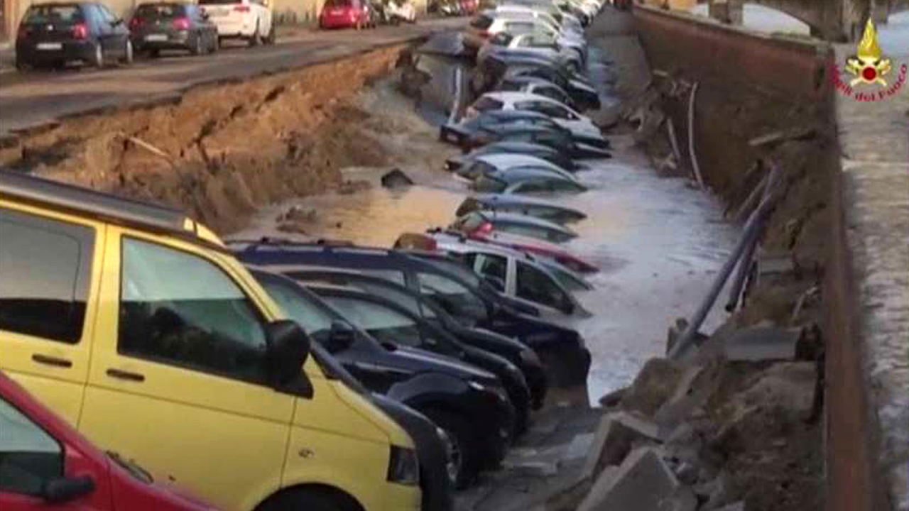 Massive sinkhole swallows dozens of cars