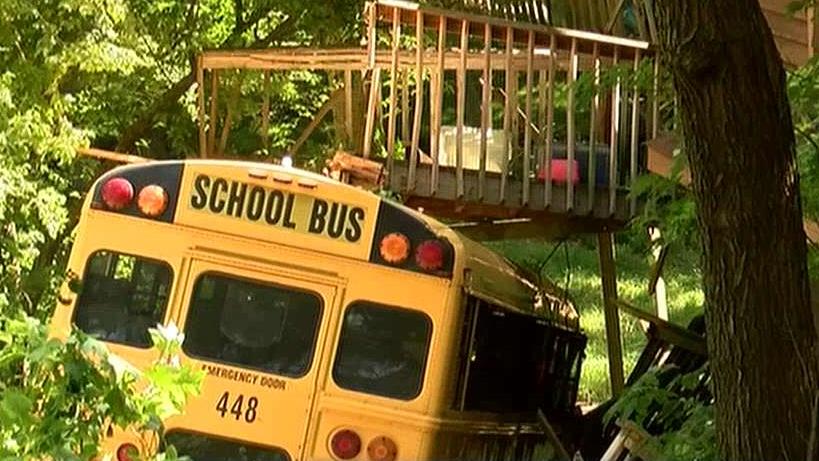 School bus runs off road, crashes into home