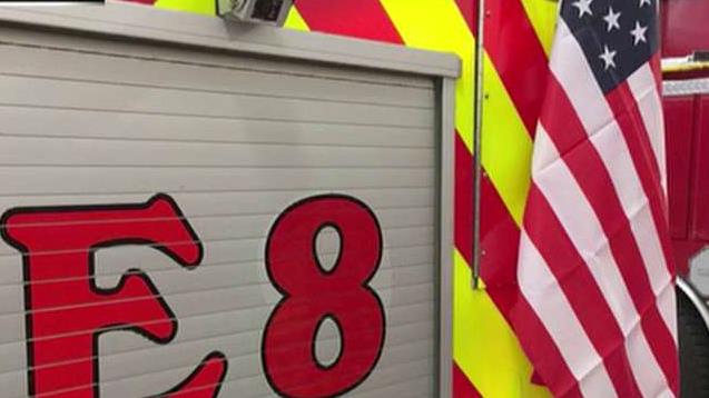 Firefighters compared to ISIS for flying flags on trucks