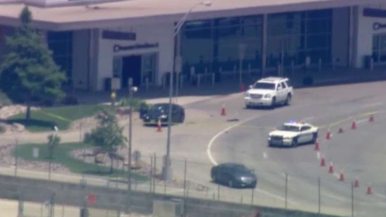 Shots fired at Dallas Love Field as bystanders look on
