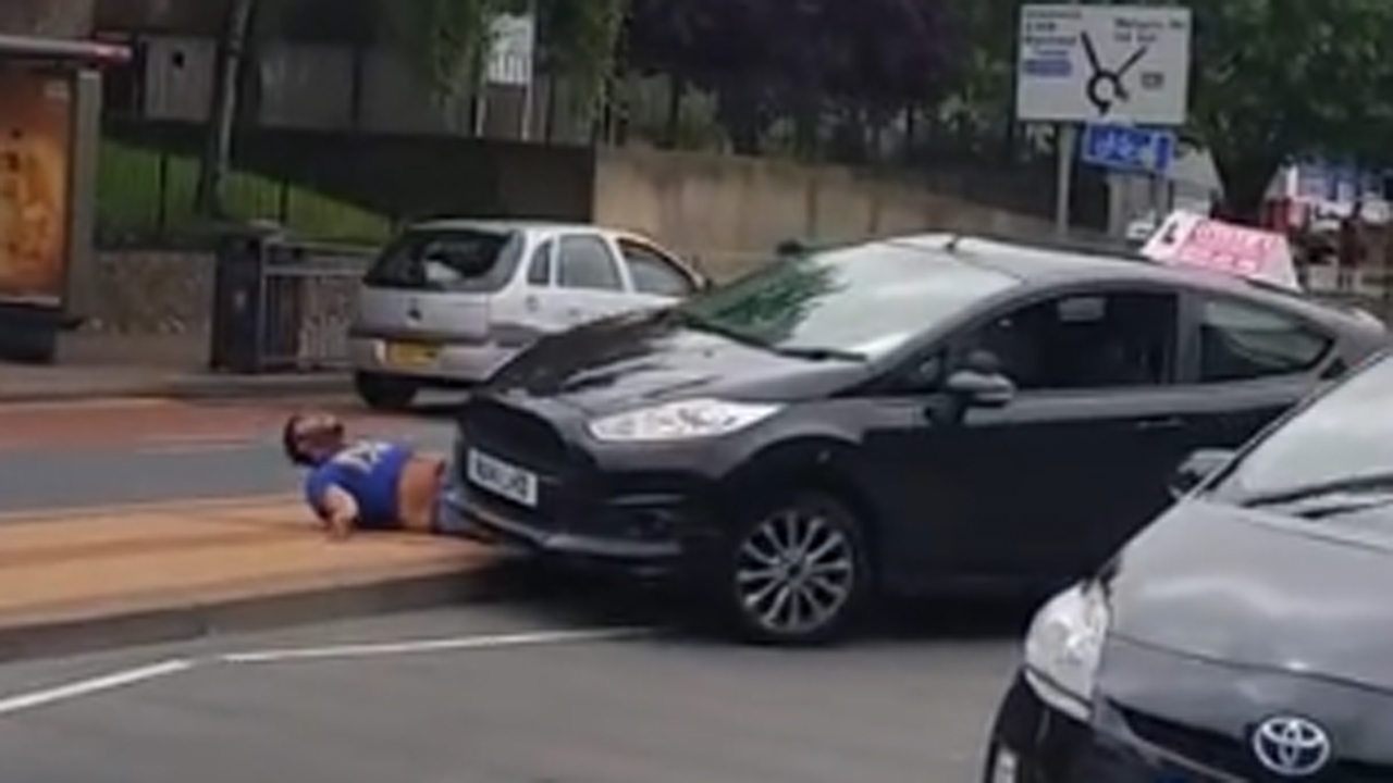 Driving instructor car rolls over man in road rage incident