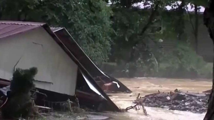 Raging floodwaters leave hundreds homeless in West Virginia