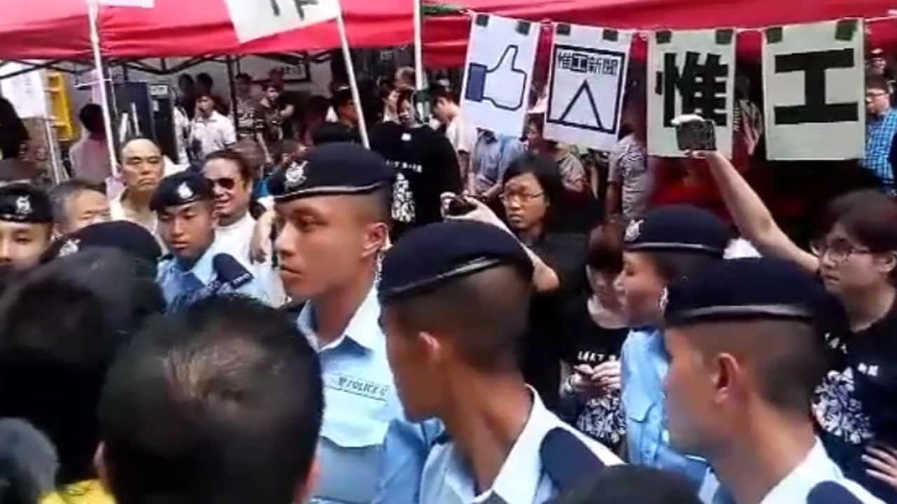 Protesters face off with government supporters in Hong Kong