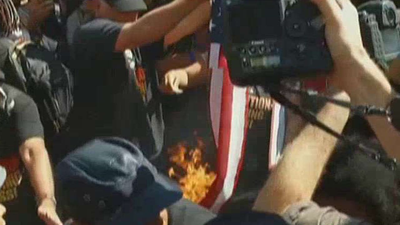 Protesters at RNC attempt to burn the American flag