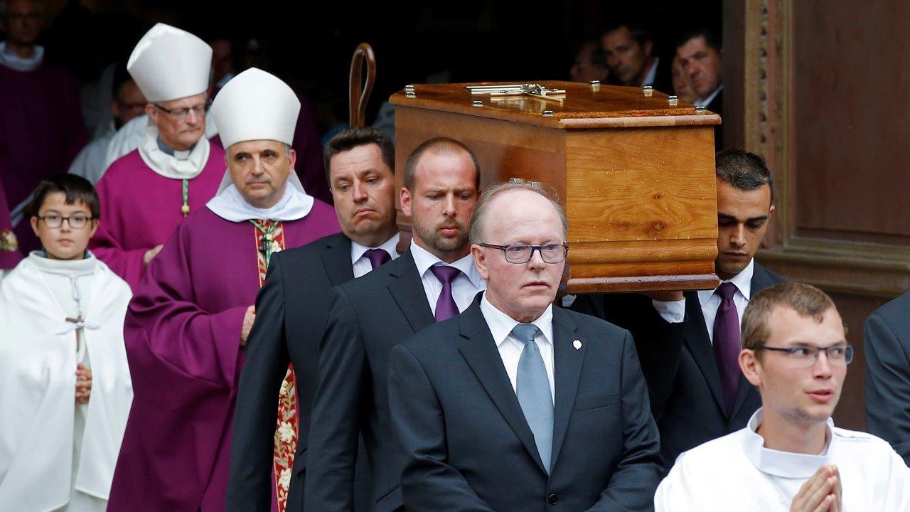 Hundreds gather to honor priest murdered in terror attack