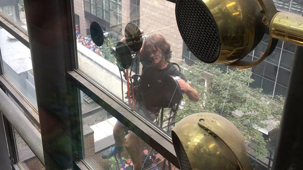 Authorities try to intercept climber scaling Trump Tower