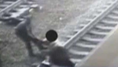 NJ Transit officer pulls man off train tracks