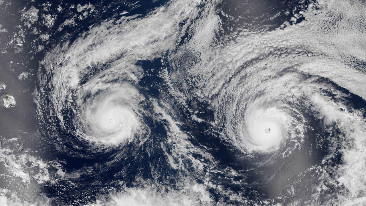Twin storms bear down on Hawaii