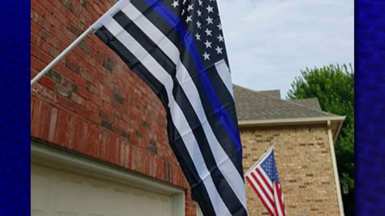 Homeowner told to remove 'offensive' pro-police flag