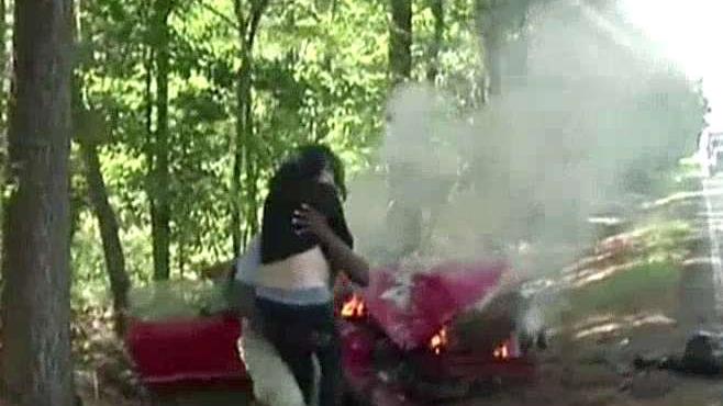 Journalist saves pregnant woman from burning car