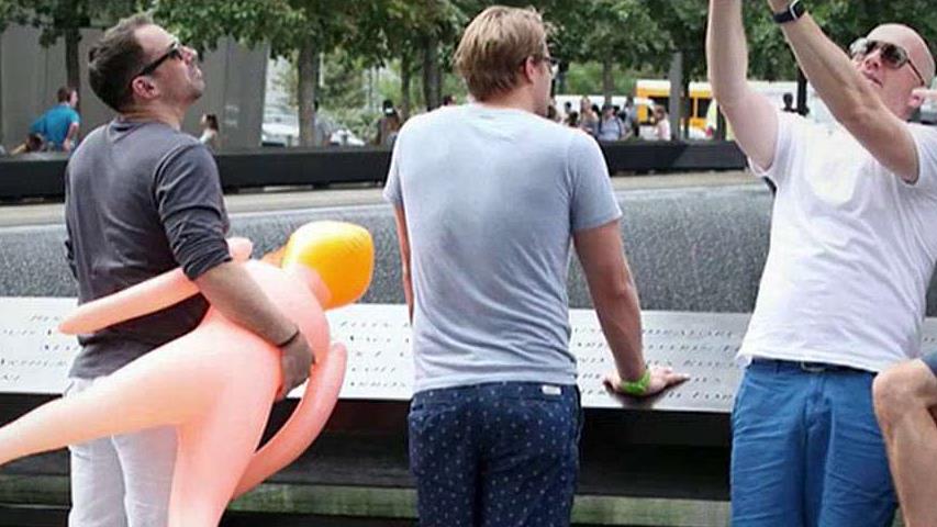 Men snap selfies with blow-up doll at 9/11 memorial