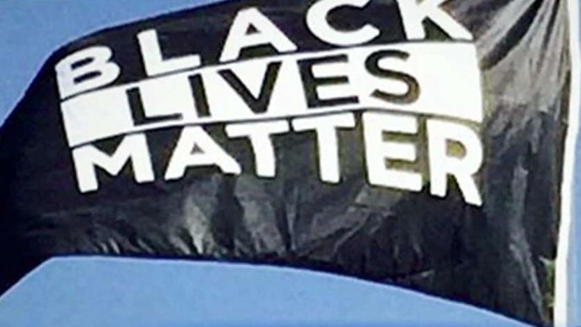 BLM flag hangs by US flag on college campus