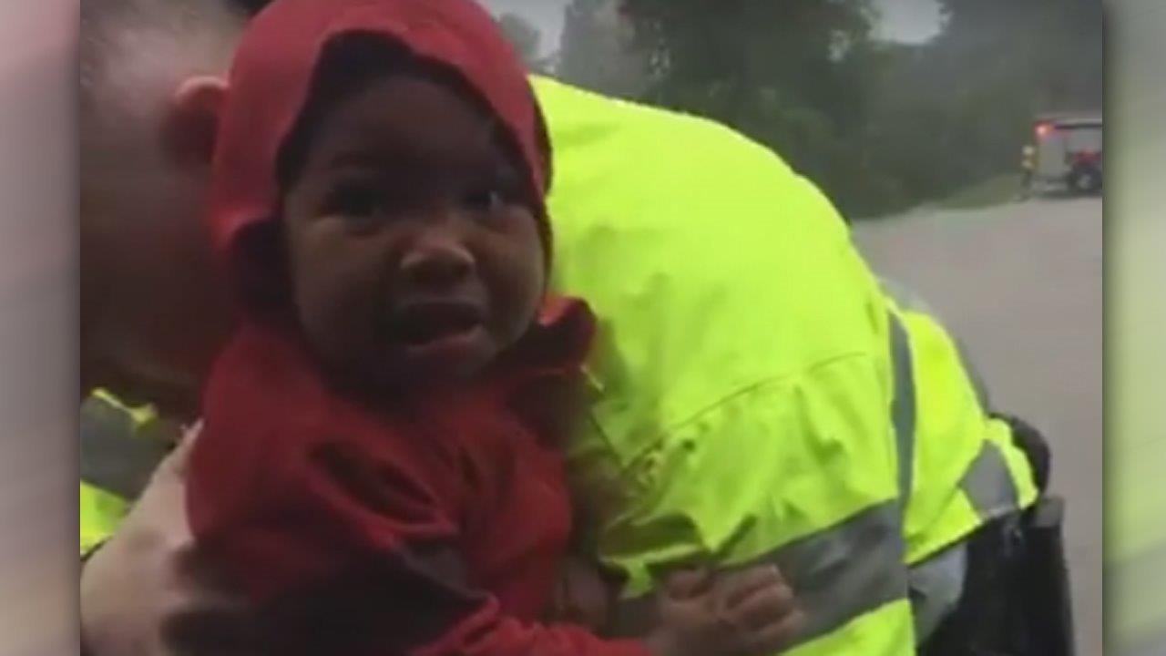 Dramatic video shows crews rescue child from sinking car