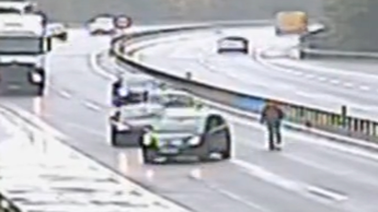 Man stops traffic chasing runaway car across highway