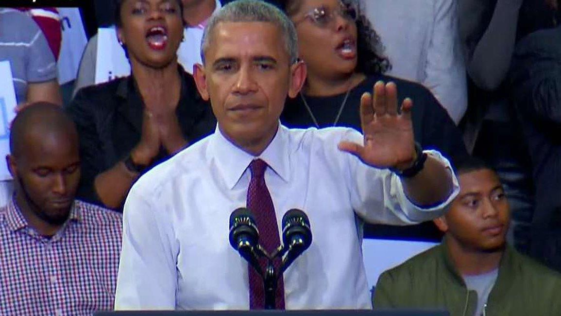 Obama tells crowd to respect protester who interrupted rally