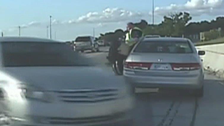 Cop narrowly avoids getting crushed by car