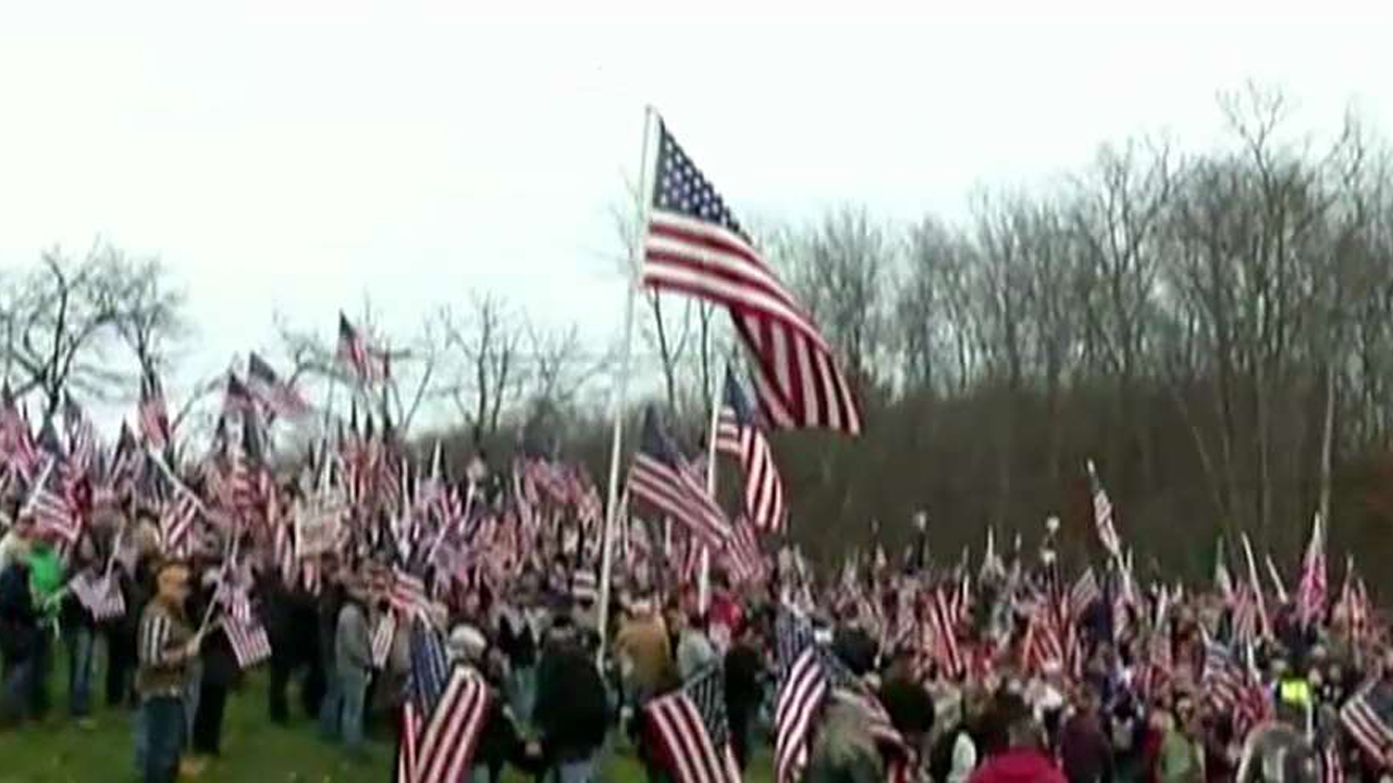 Vets protest removal of US flag from Massachusetts college