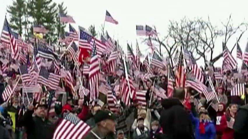 Vets protest against college's decision to remove the flag