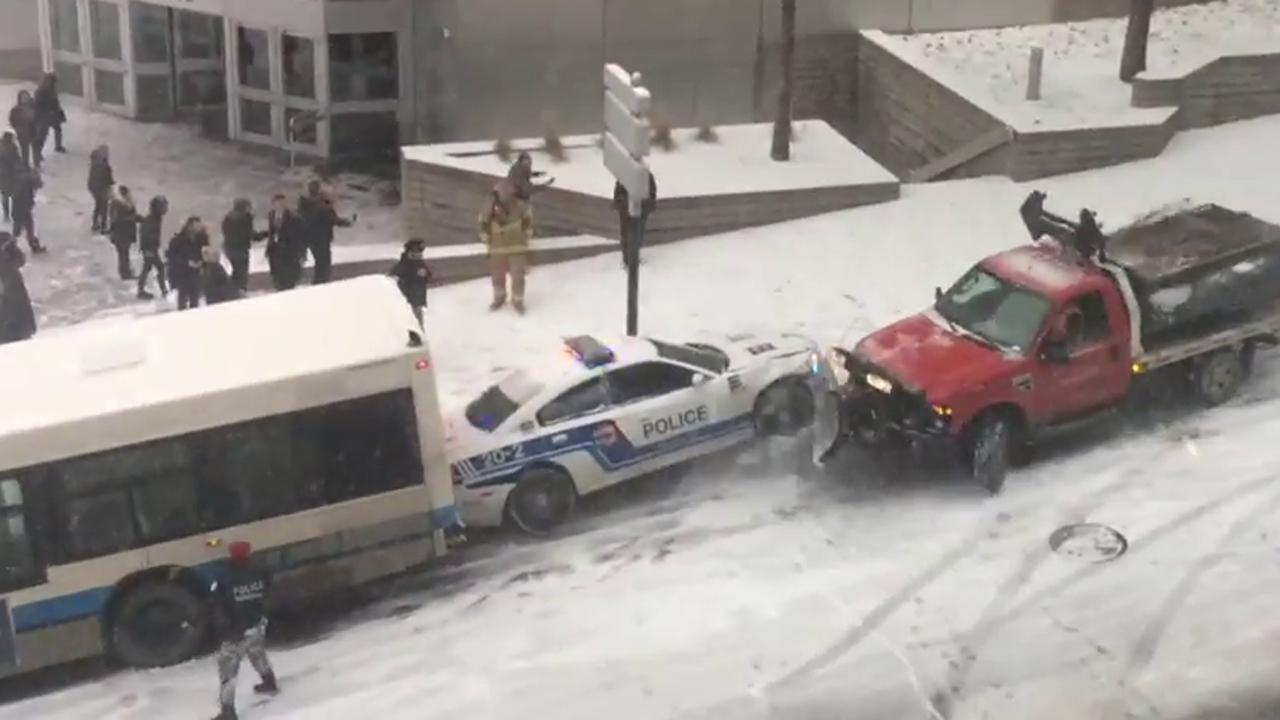 Busses, police car, snow plow involved in icy street pile up