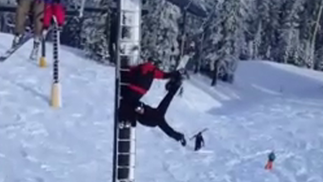 'Better hold on tight': Man dangling from ski lift rescued