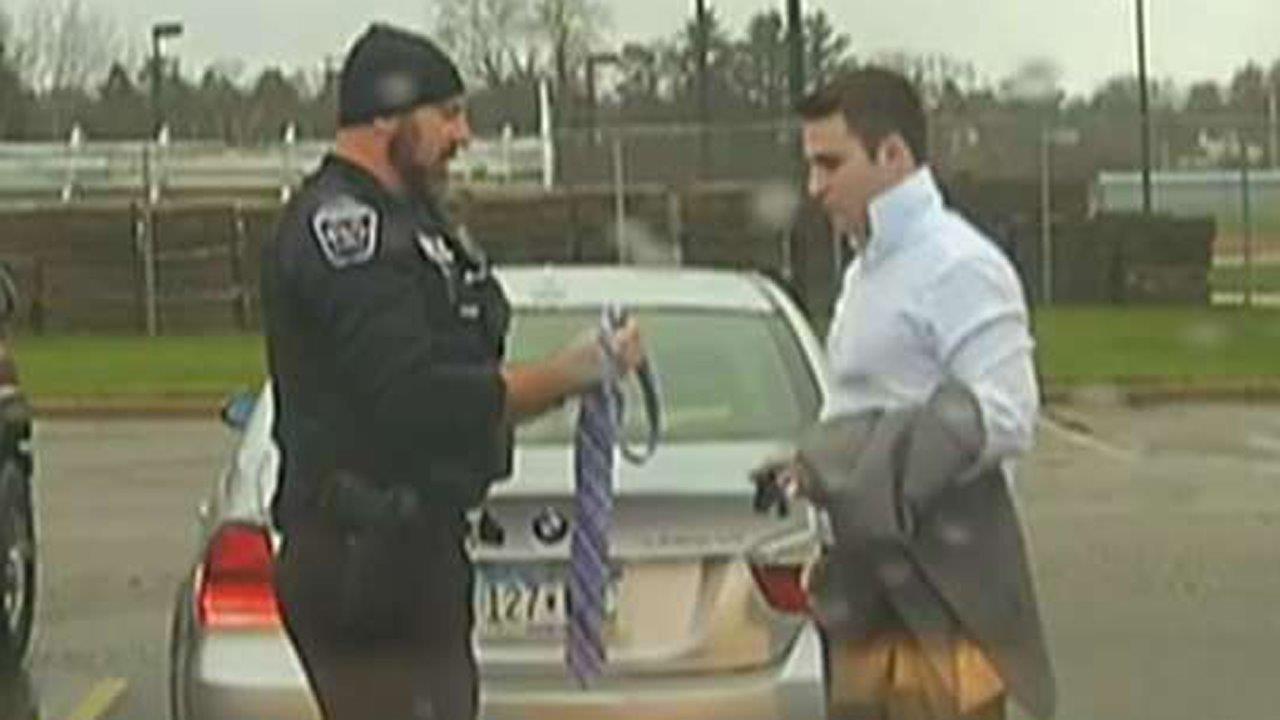 Officer teaches speeding student how to tie a necktie